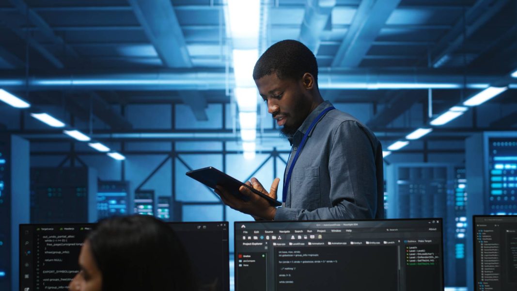 technician-inspecting-mainframes-ensuring-malfunc-2024-06-12-02-24-02-utc